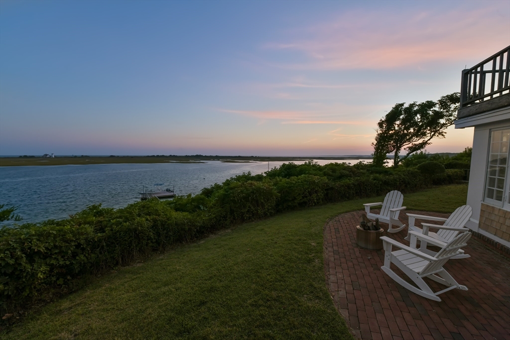 70 Sears Point Chatham, MA 02633 - Photo 42 of 42 a view of a lake with lawn chairs
