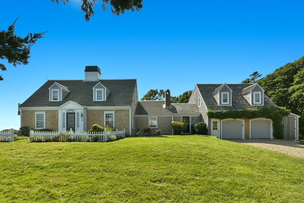 70 Sears Point Chatham, MA 02633 - Photo 5 of 42 a front view of a house with a yard