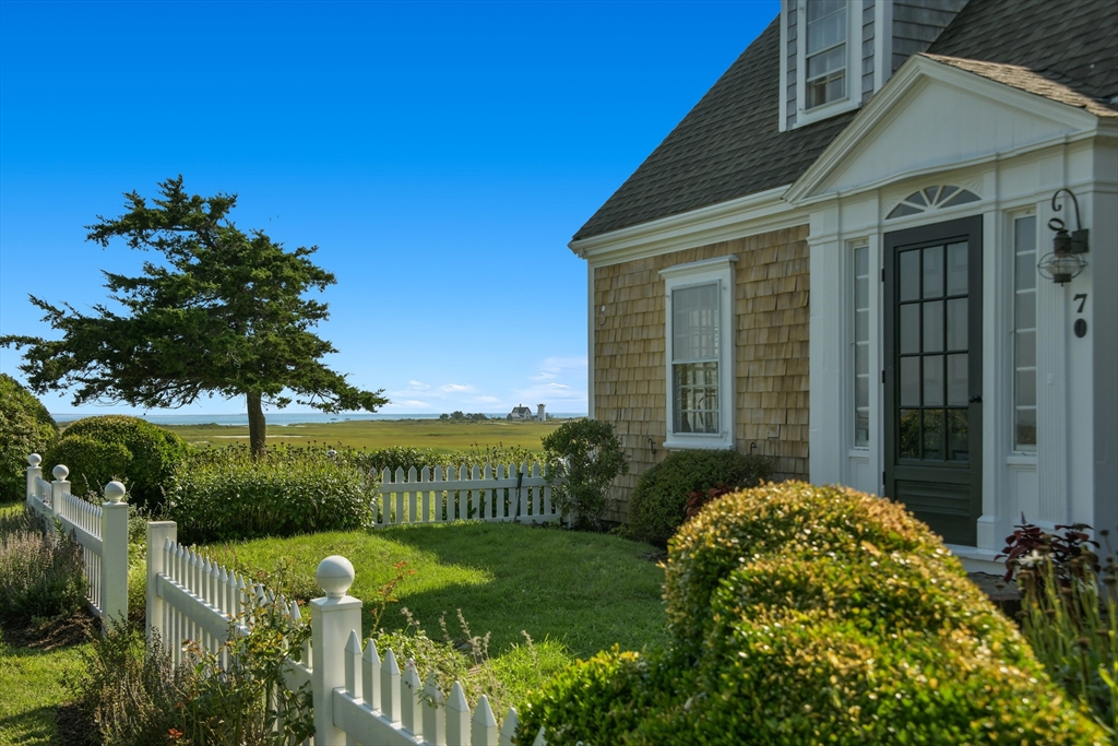 70 Sears Point Chatham, MA 02633 - Photo 6 of 42 a view of a house with a garden