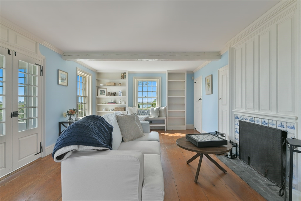 70 Sears Point Chatham, MA 02633 - Photo 8 of 42 a living room with furniture and a fireplace