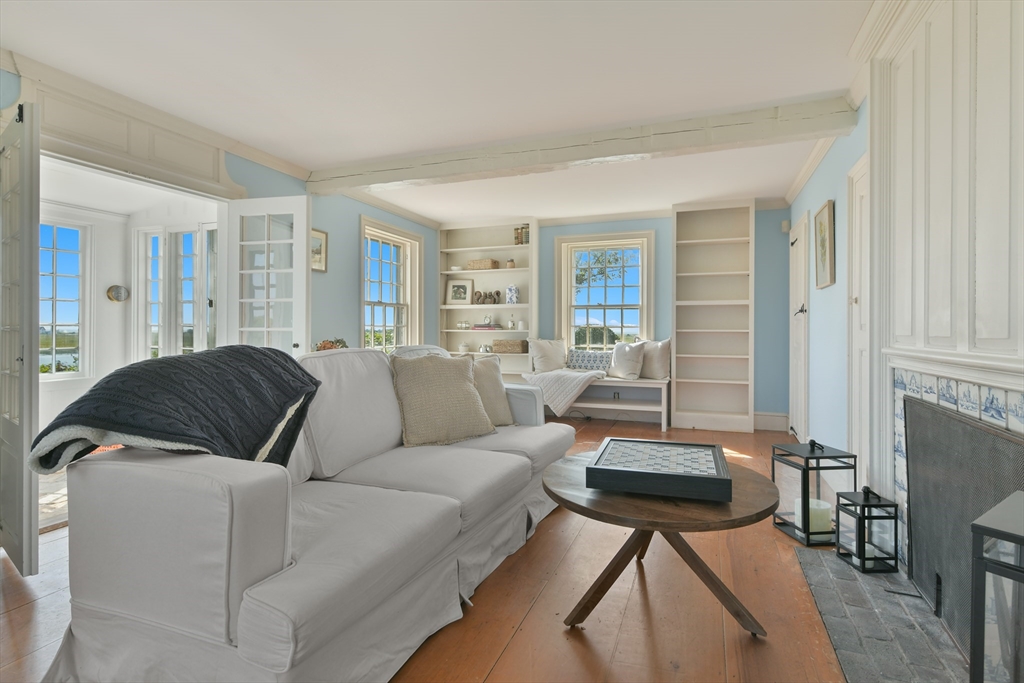 70 Sears Point Chatham, MA 02633 - Photo 9 of 42 a living room with furniture and a fireplace