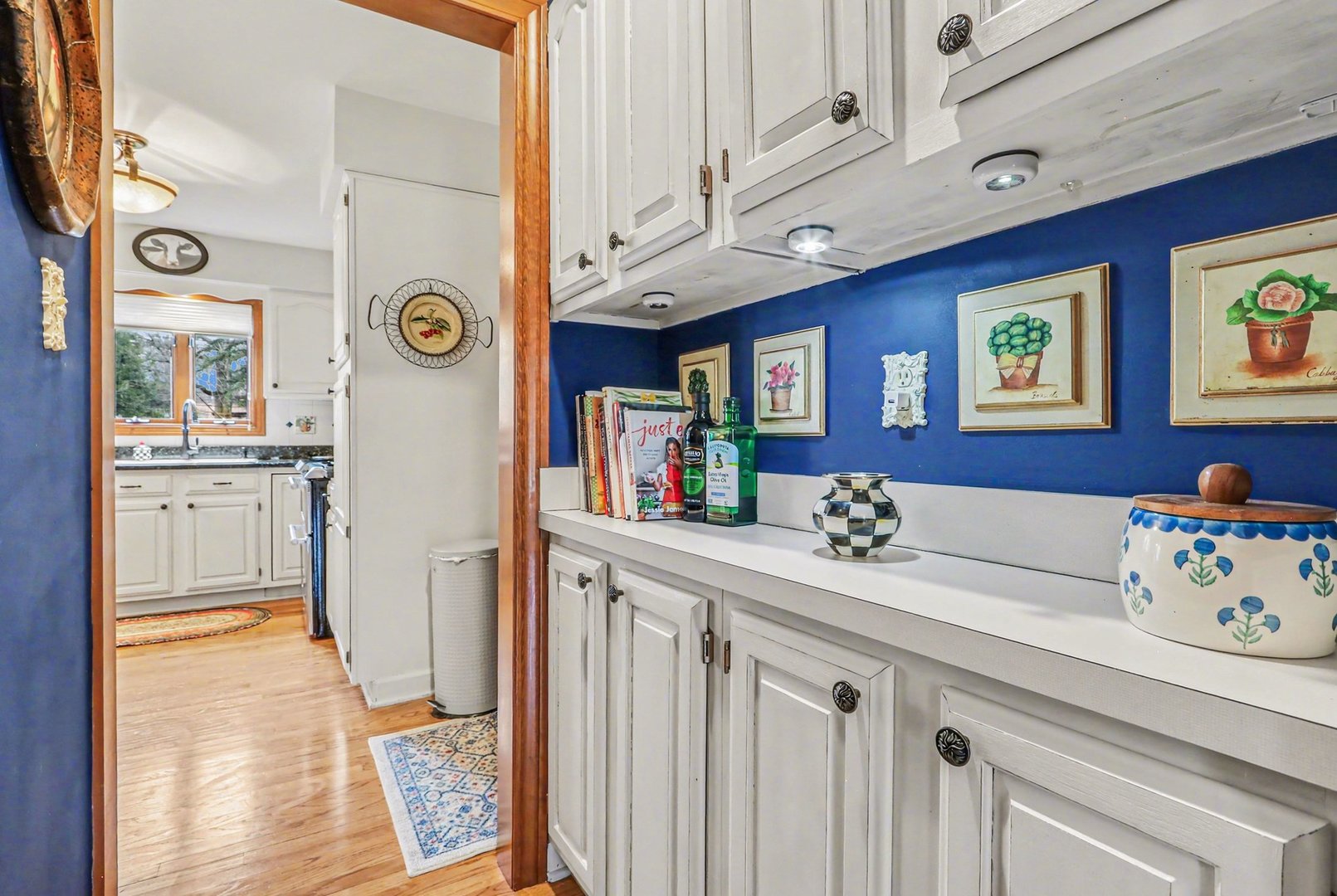 570 Violet Lane Batavia, IL 60510 - Photo 8 of 28 a view of a kitchen with furniture and wooden floor