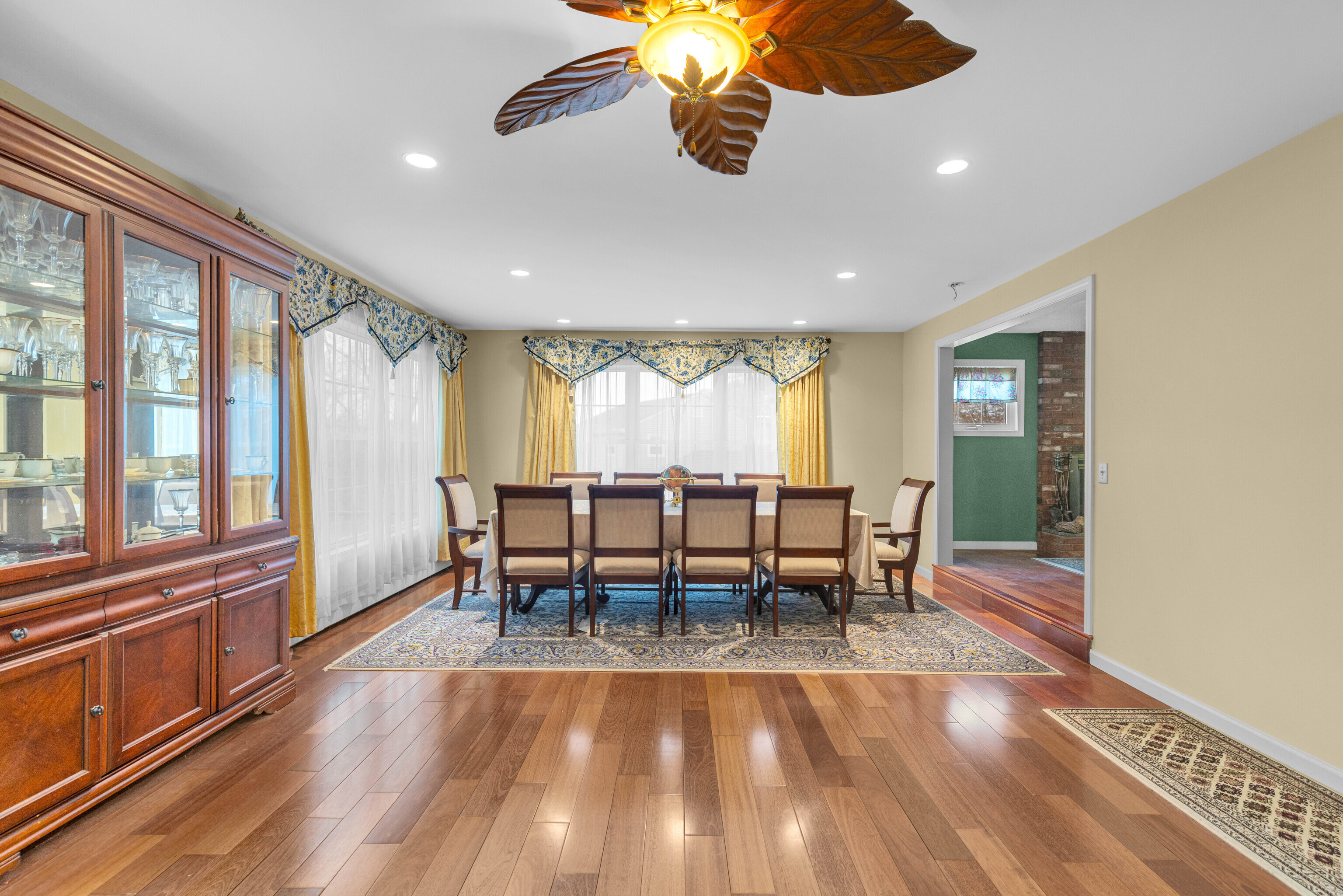 63 Timber Hill Road Cromwell, CT 06416 - Photo 12 of 29 a view of a dining room with furniture a chandelier and wooden floor