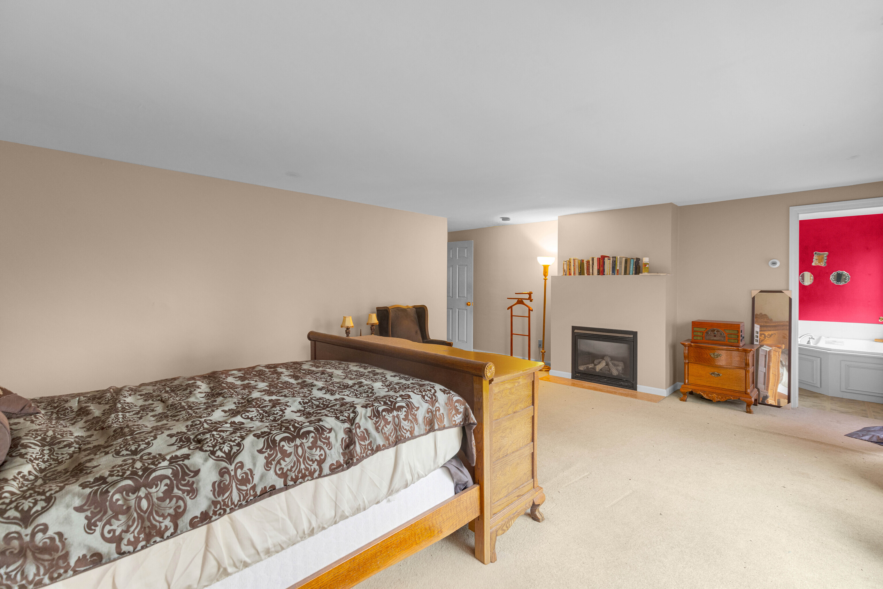 63 Timber Hill Road Cromwell, CT 06416 - Photo 20 of 29 a bedroom with a bed and a fireplace