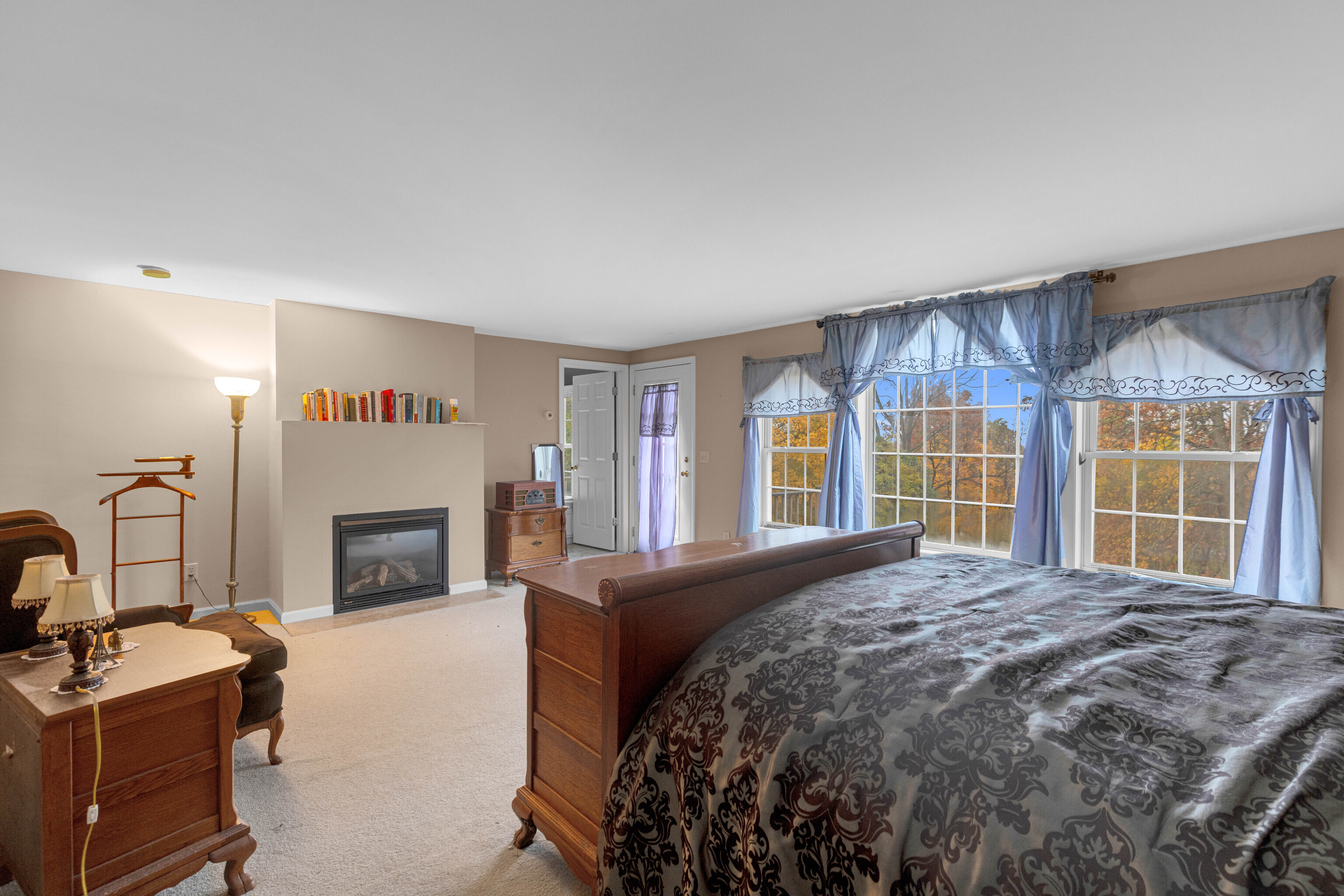 63 Timber Hill Road Cromwell, CT 06416 - Photo 21 of 29 a spacious bedroom with a bed and a fireplace