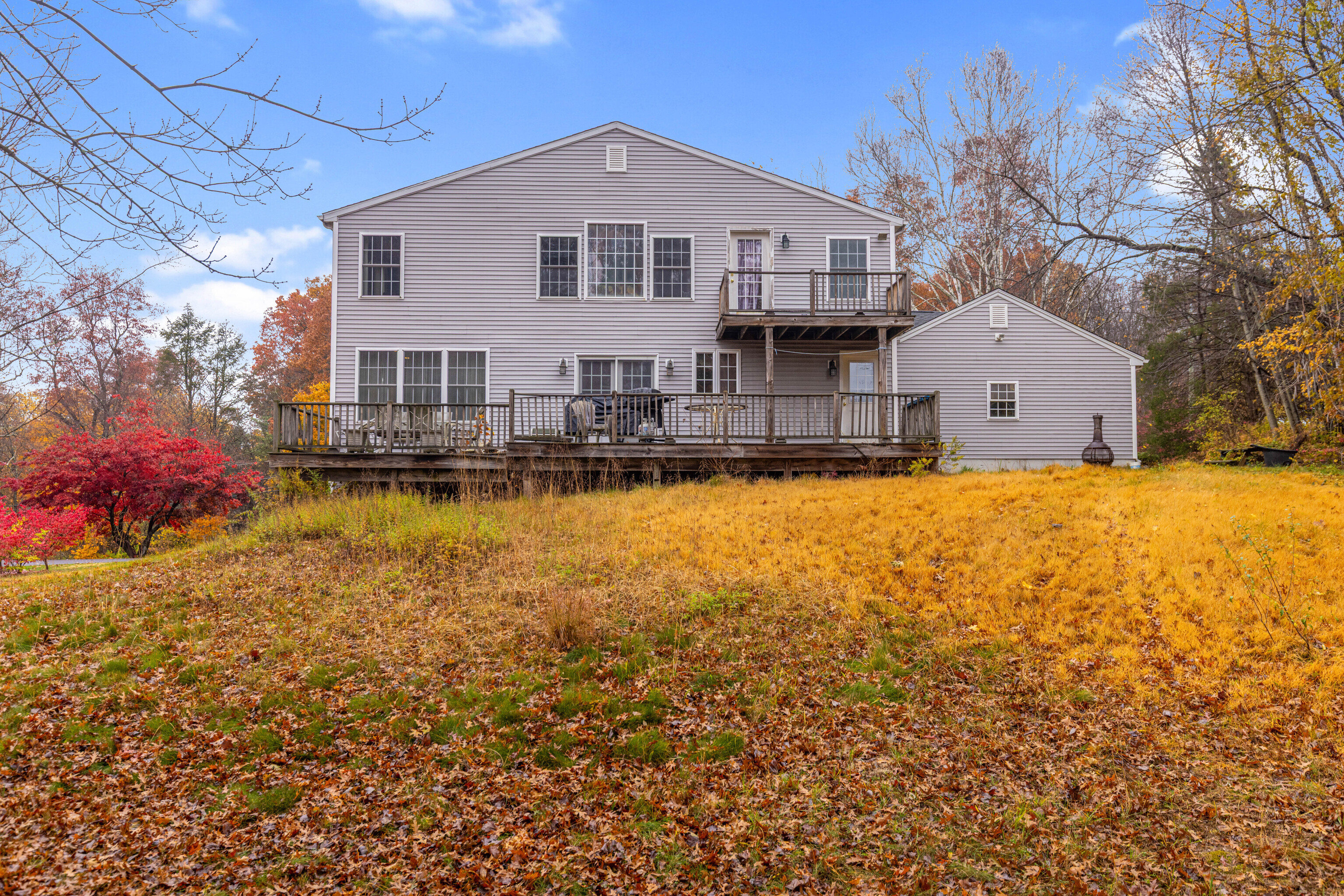 63 Timber Hill Road Cromwell, CT 06416 - Photo 28 of 29 a front view of a house with a yard and garage