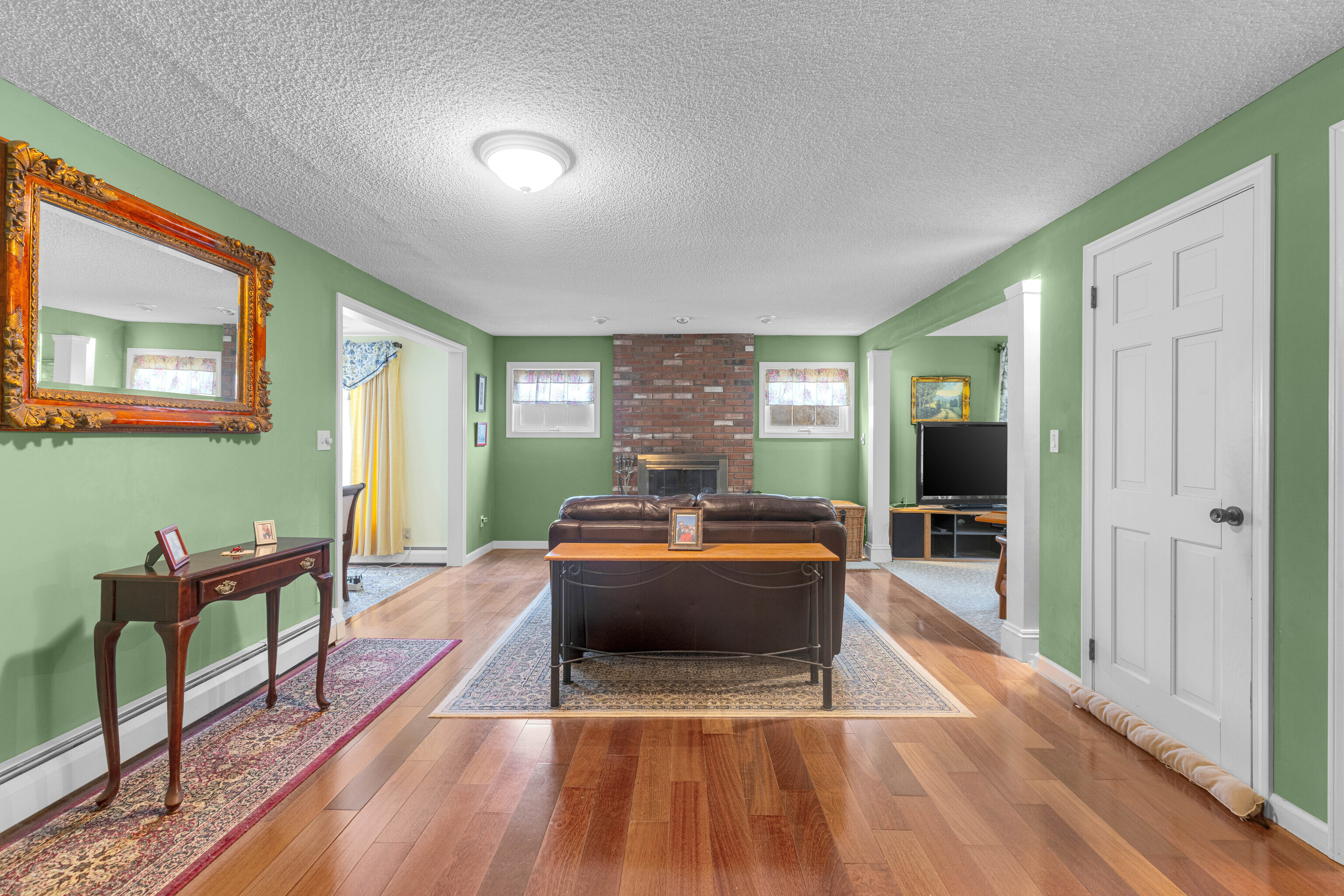 63 Timber Hill Road Cromwell, CT 06416 - Photo 4 of 29 a living room with furniture and a wooden floor