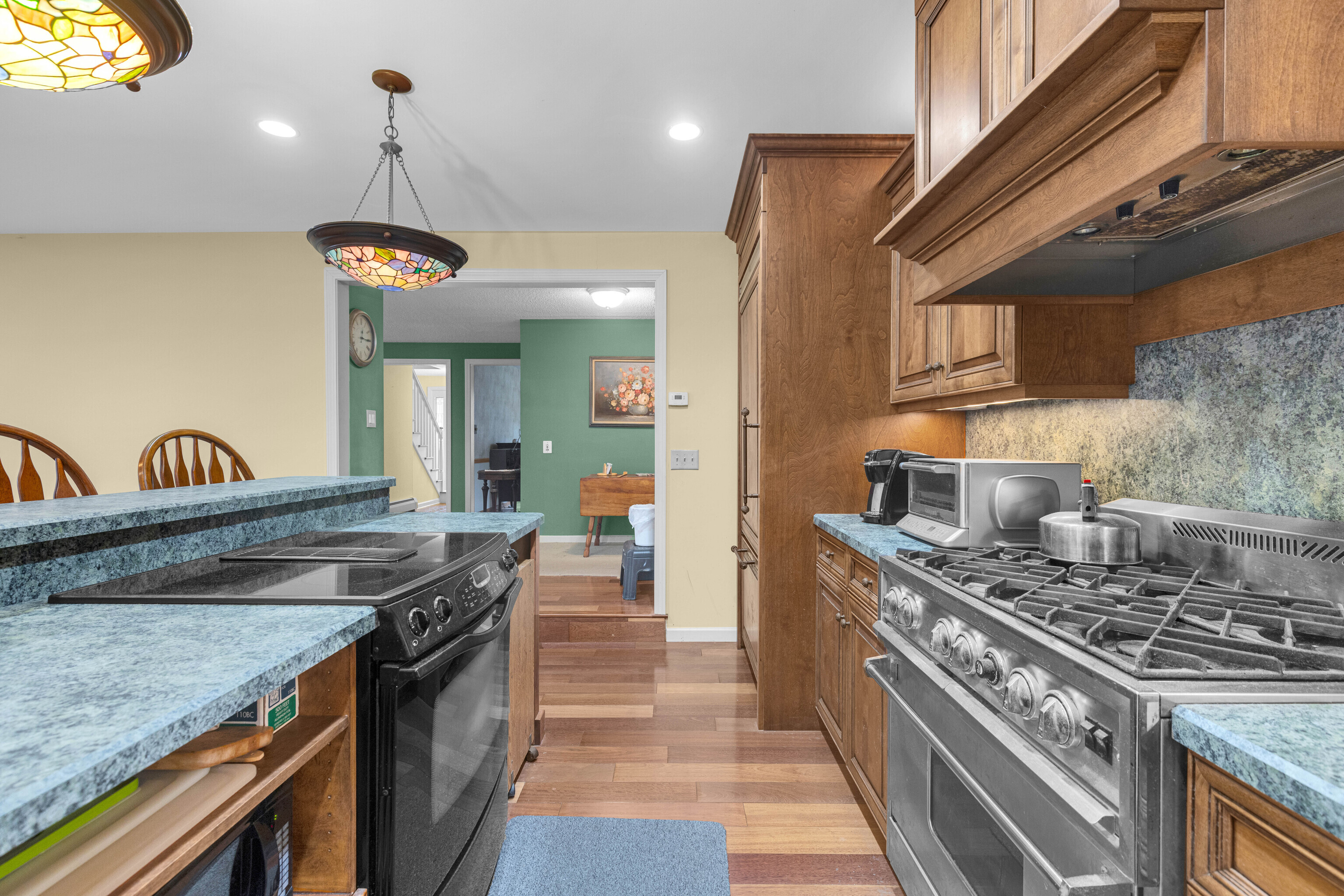 63 Timber Hill Road Cromwell, CT 06416 - Photo 9 of 29 a kitchen with granite countertop a stove and a sink