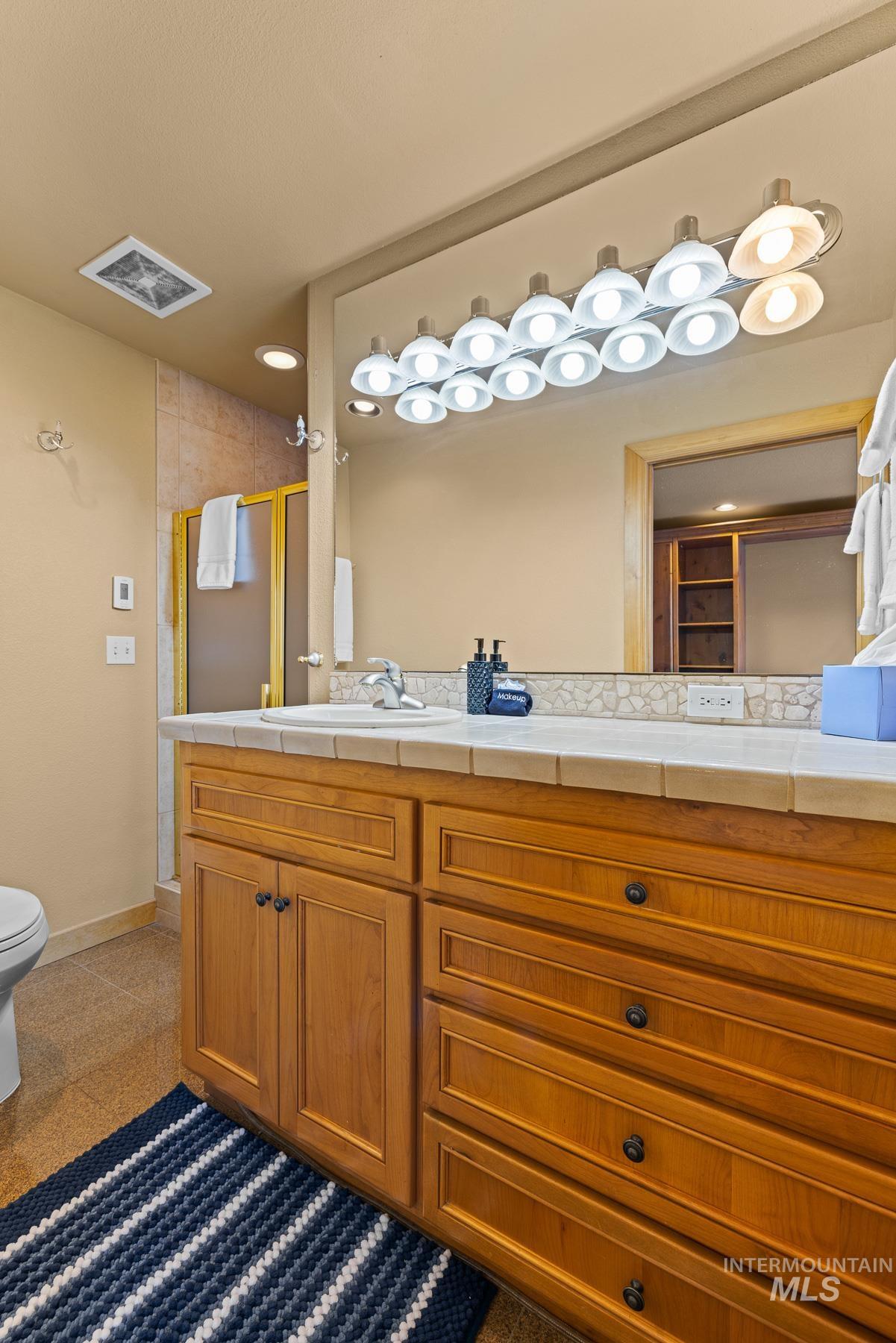101 East Lake Street, Unit C15 McCall, ID 83638 - Photo 21 of 48 Bathroom featuring double vanity and heated floors
