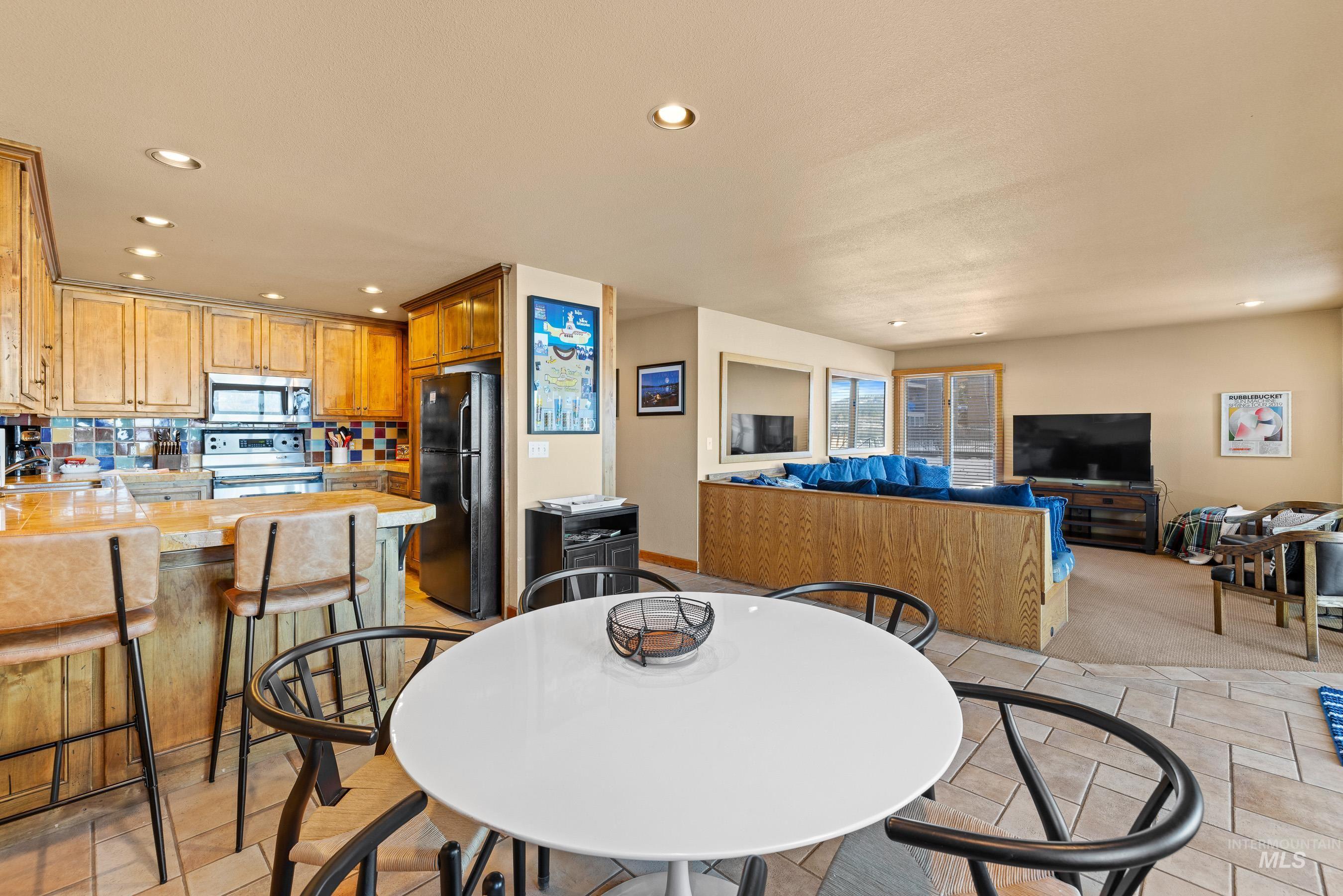 101 East Lake Street, Unit C15 McCall, ID 83638 - Photo 8 of 48 Dining space with recessed lighting, heated tile floors