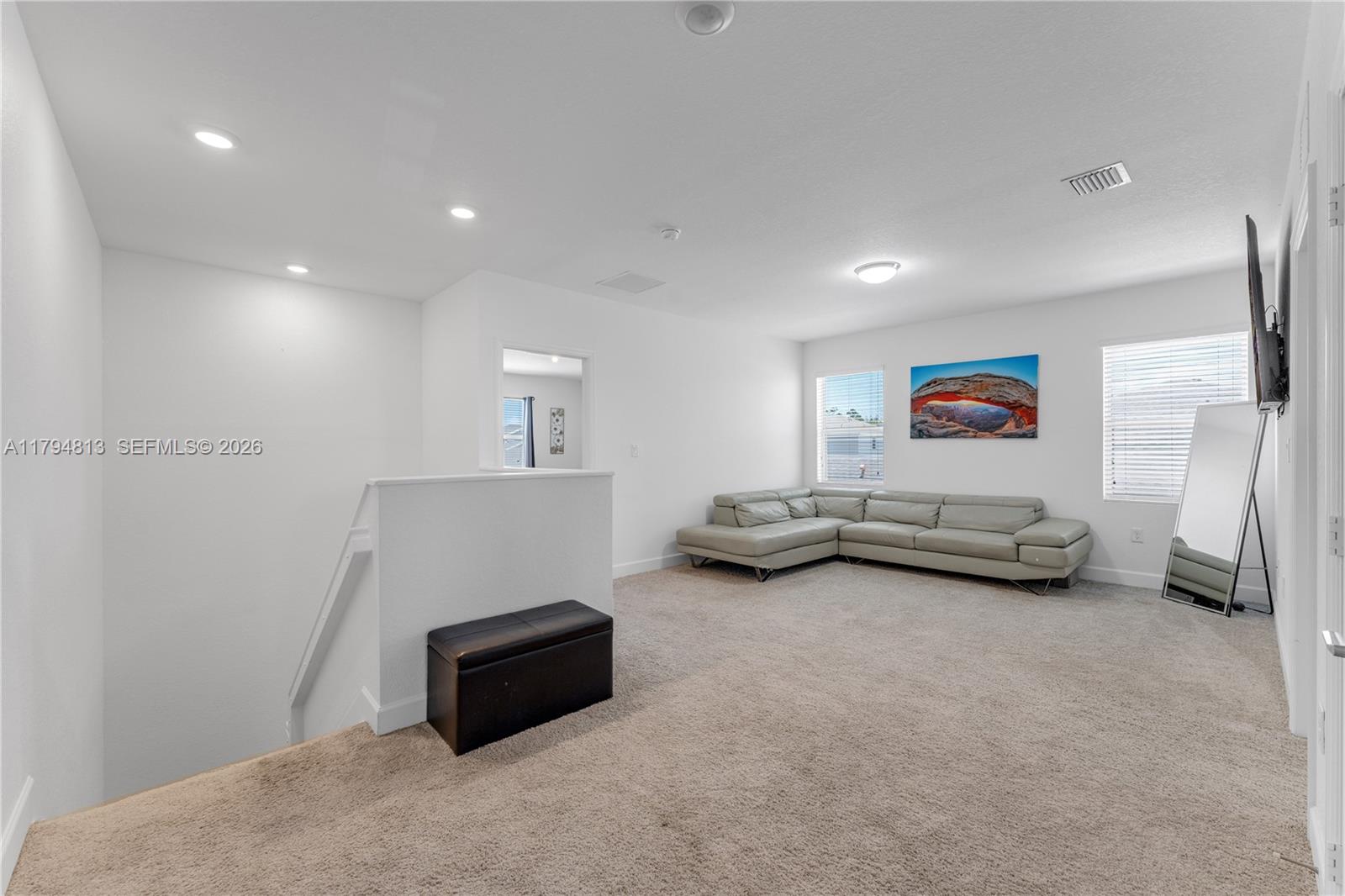 13225 Southwest 272nd Street Homestead, FL 33032 - Photo 11 of 44 a room with furniture and a flat screen tv