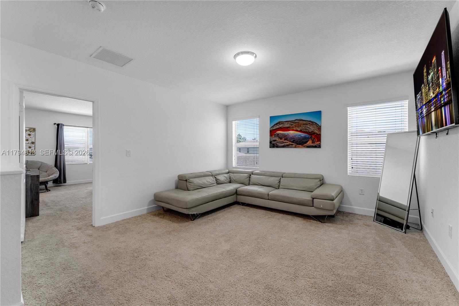 13225 Southwest 272nd Street Homestead, FL 33032 - Photo 12 of 44 a living room with furniture and a couch