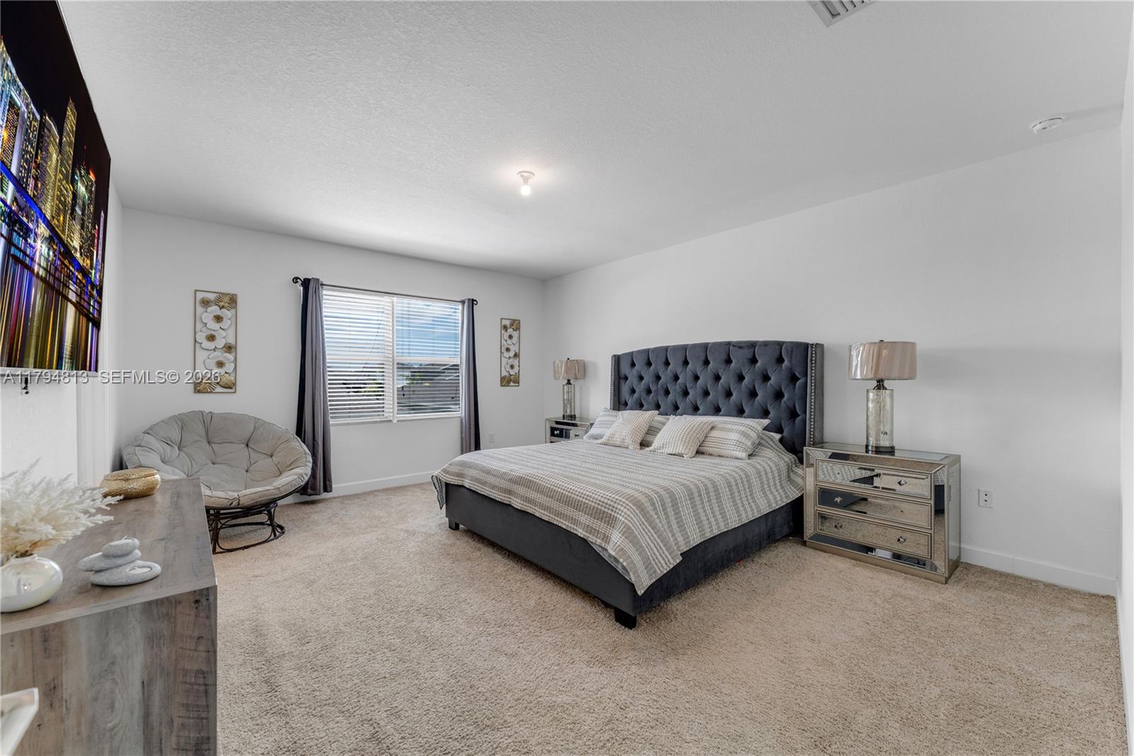 13225 Southwest 272nd Street Homestead, FL 33032 - Photo 13 of 44 a spacious bedroom with a bed and a large window