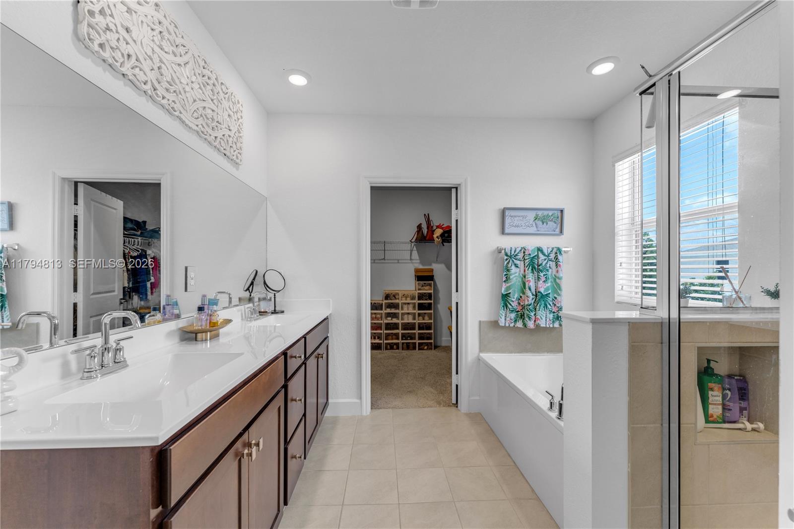 13225 Southwest 272nd Street Homestead, FL 33032 - Photo 15 of 44 a bathroom with a tub sink and mirror