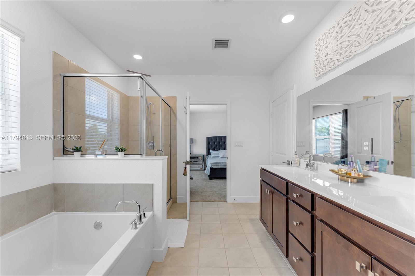 13225 Southwest 272nd Street Homestead, FL 33032 - Photo 16 of 44 a bathroom with a tub sink and mirror
