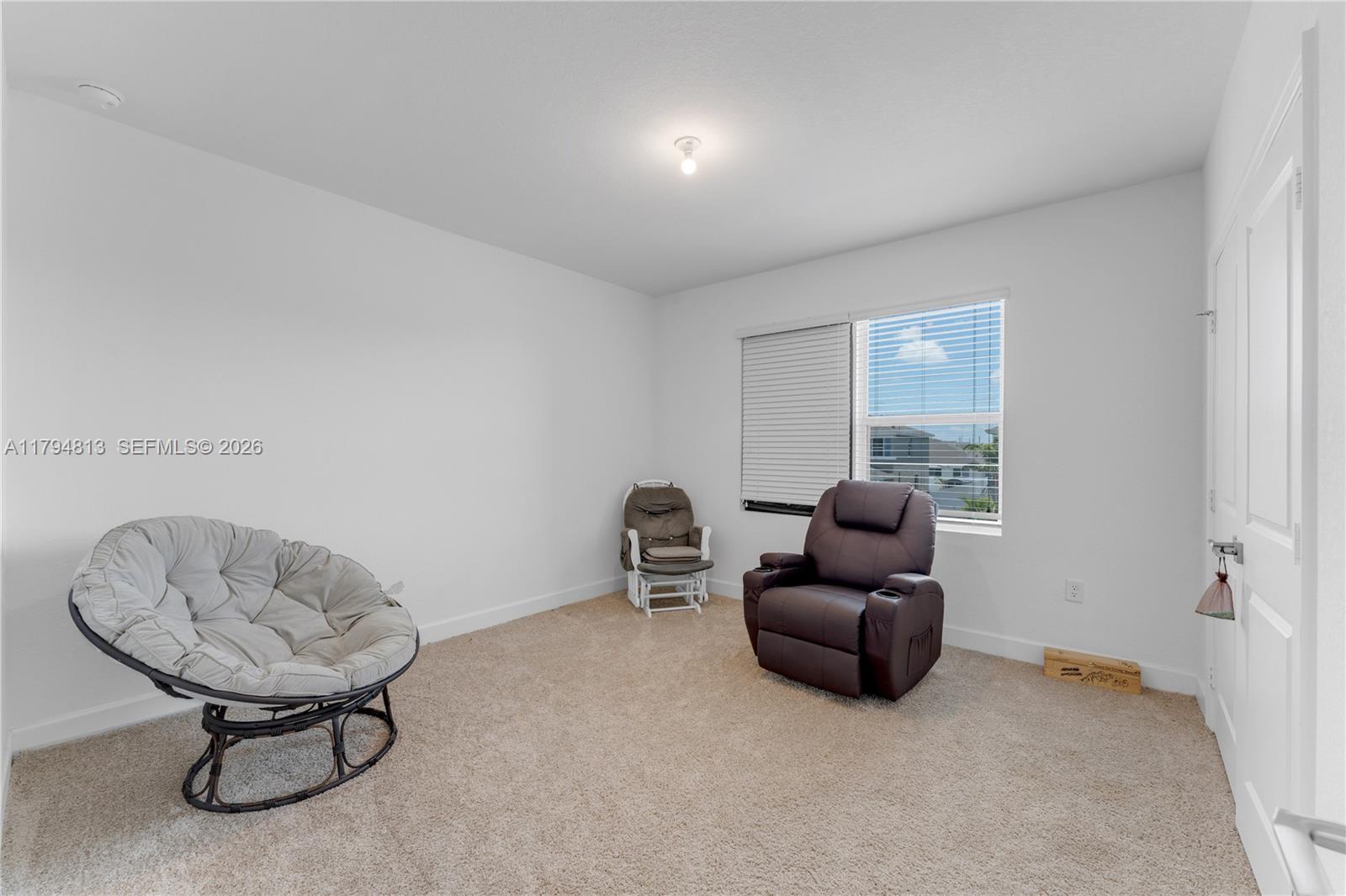 13225 Southwest 272nd Street Homestead, FL 33032 - Photo 20 of 44 a livingroom with furniture and a window
