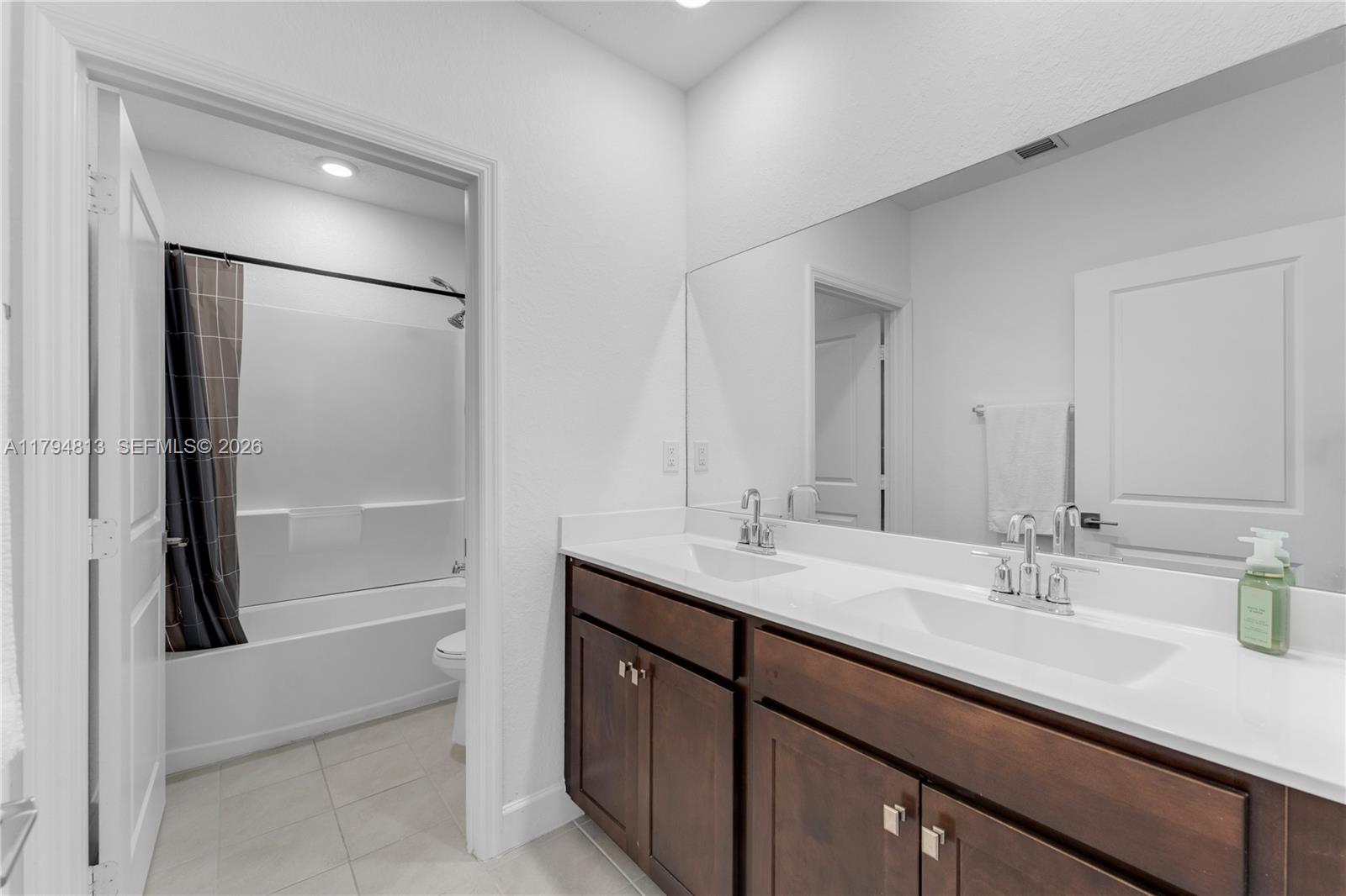13225 Southwest 272nd Street Homestead, FL 33032 - Photo 22 of 44 a bathroom with a sink and a mirror
