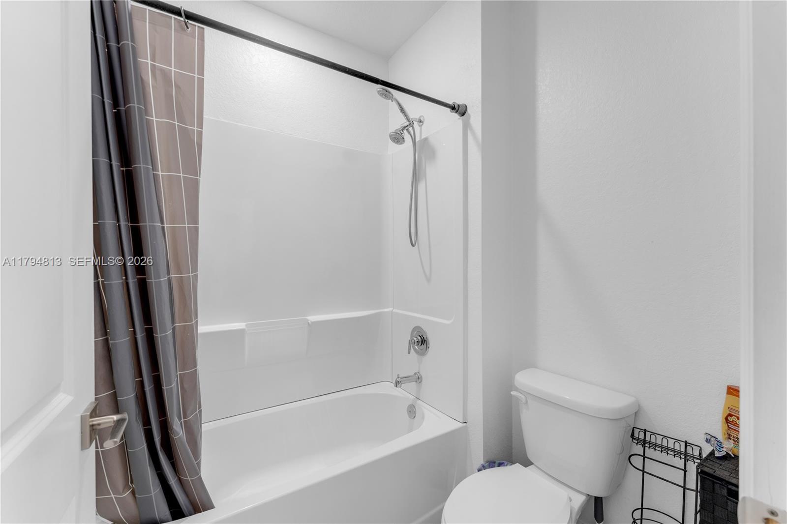 13225 Southwest 272nd Street Homestead, FL 33032 - Photo 23 of 44 a bathroom with a toilet and a bathtub