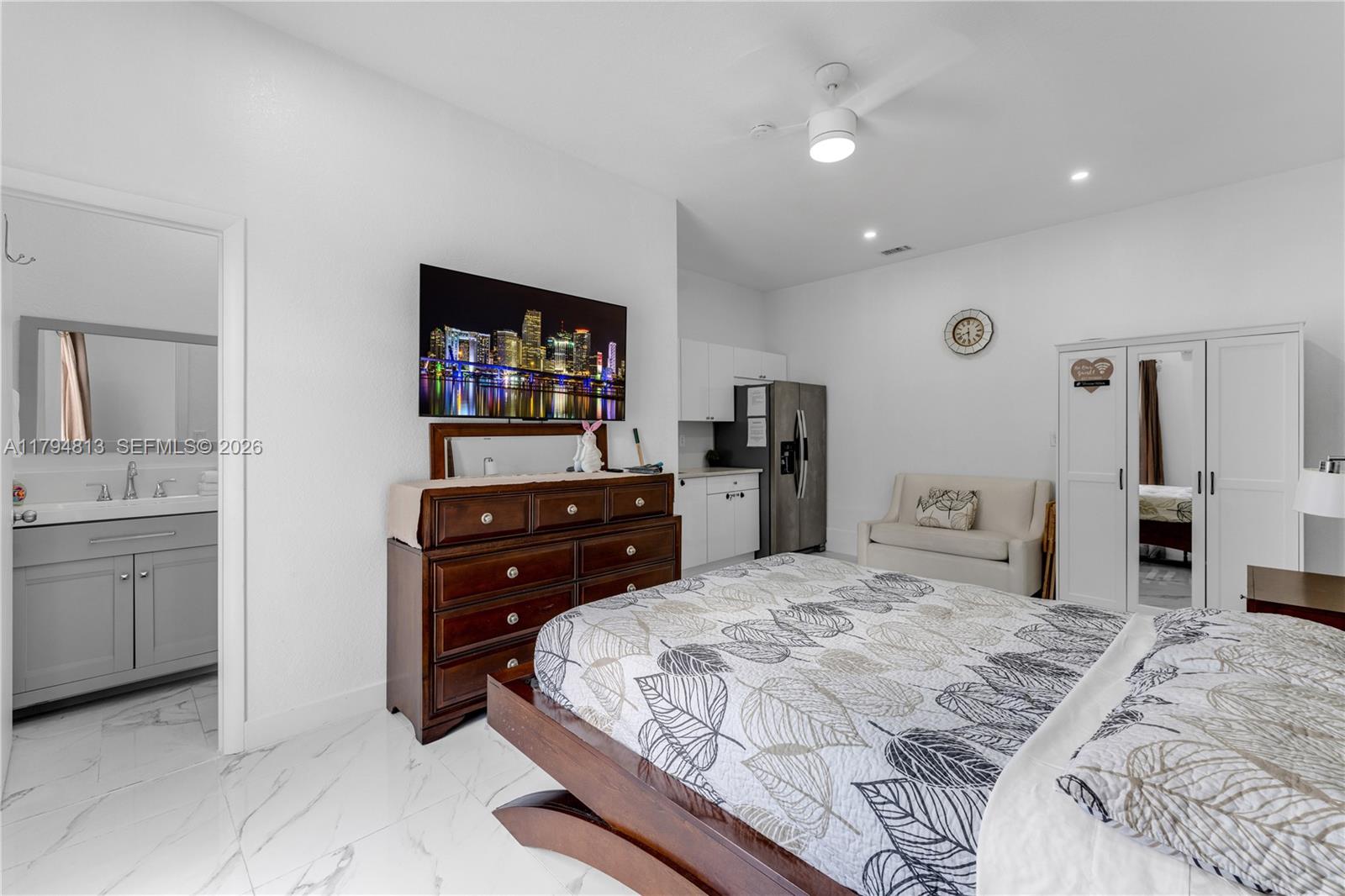 13225 Southwest 272nd Street Homestead, FL 33032 - Photo 26 of 44 a bedroom with a bed and cabinets