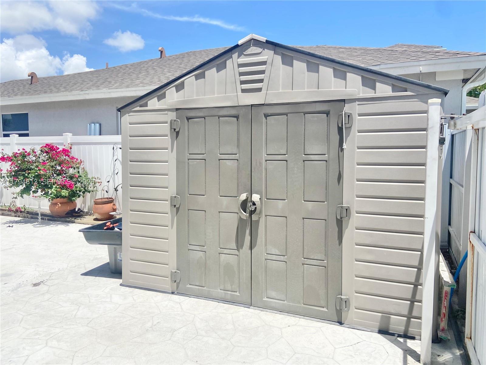 13225 Southwest 272nd Street Homestead, FL 33032 - Photo 40 of 44 a view of a house with a balcony