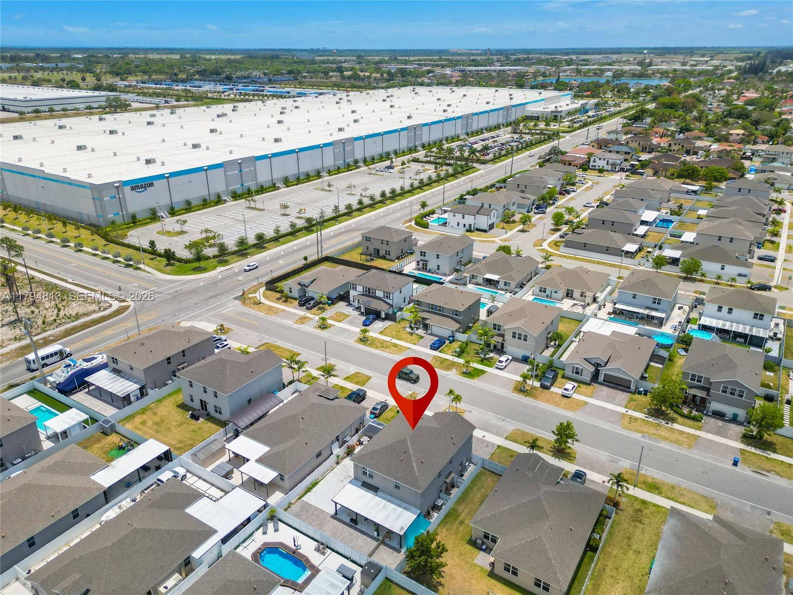 13225 Southwest 272nd Street Homestead, FL 33032 - Photo 42 of 44 an aerial view of residential houses and outdoor space