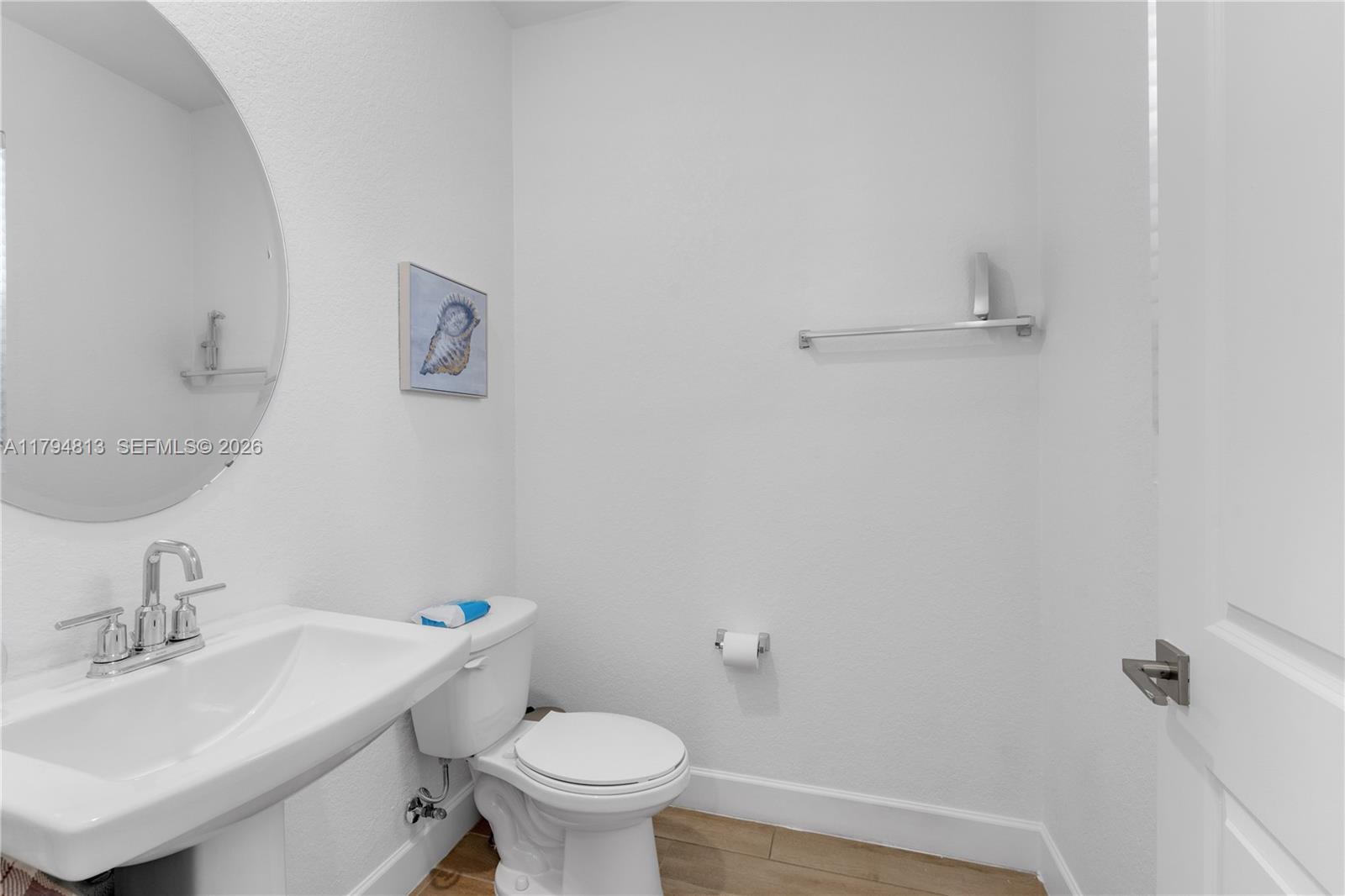 13225 Southwest 272nd Street Homestead, FL 33032 - Photo 10 of 44 a bathroom with a sink and a toilet