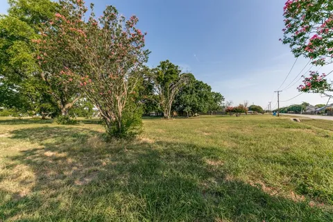 a view of outdoor space with deck and yard