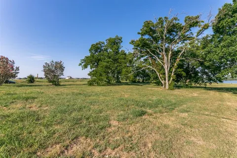 a view of outdoor space with deck area and trees