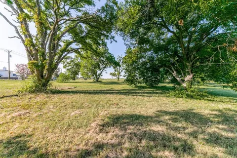 a view of backyard with outdoor space