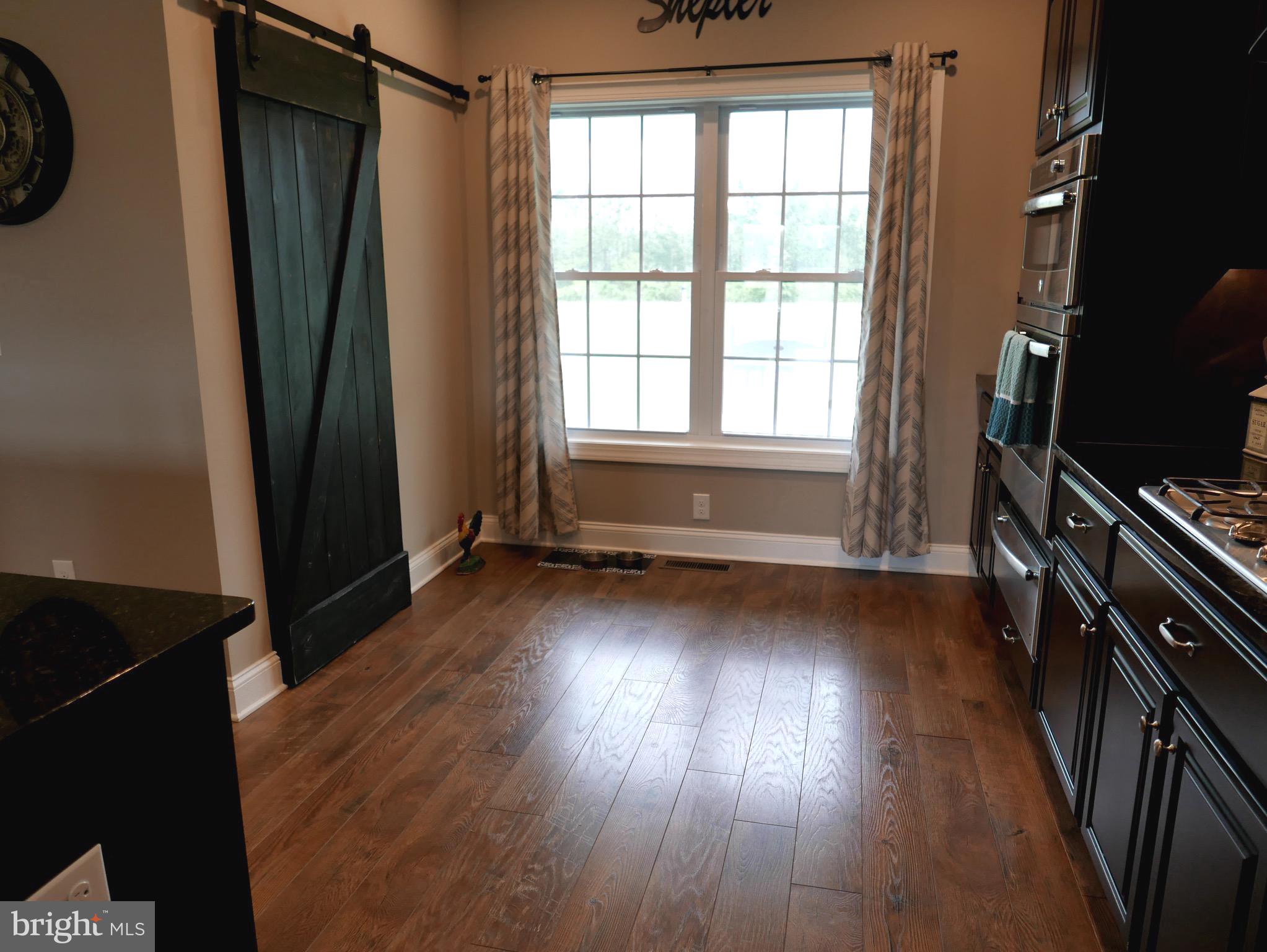 27980 Substation Road Denton, MD 21629 - Photo 12 of 48 Sliding barn door opens to Pantry.