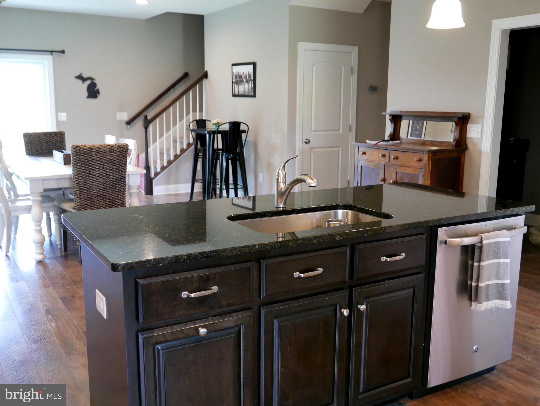 27980 Substation Road Denton, MD 21629 - Photo 17 of 48 Kitchen island w/ dishwasher, sink & bar seating
