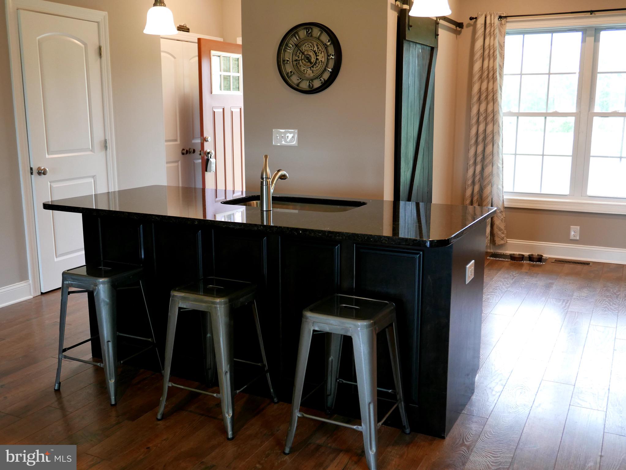 27980 Substation Road Denton, MD 21629 - Photo 19 of 48 Bar stool seating/eating on kitchen island.
