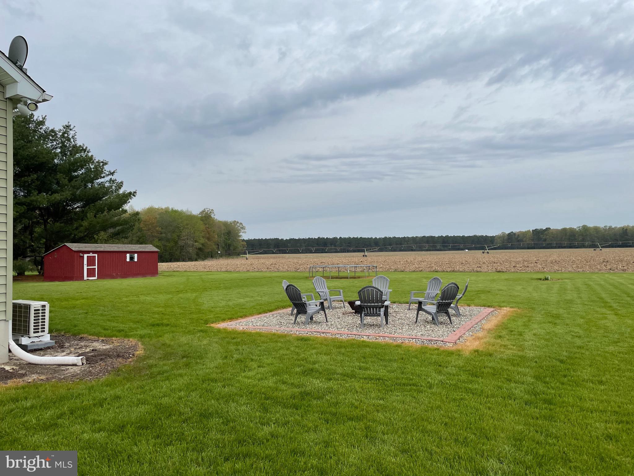 27980 Substation Road Denton, MD 21629 - Photo 5 of 48 Back yard, fire pit and shed.