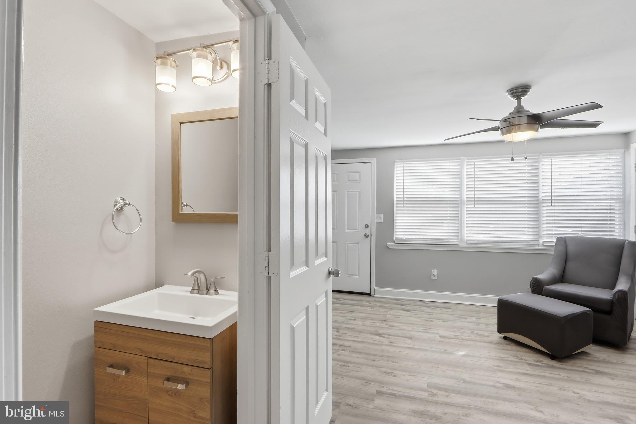 4432 Annapolis Road Baltimore, MD 21227 - Photo 12 of 31 a living room with furniture and a window