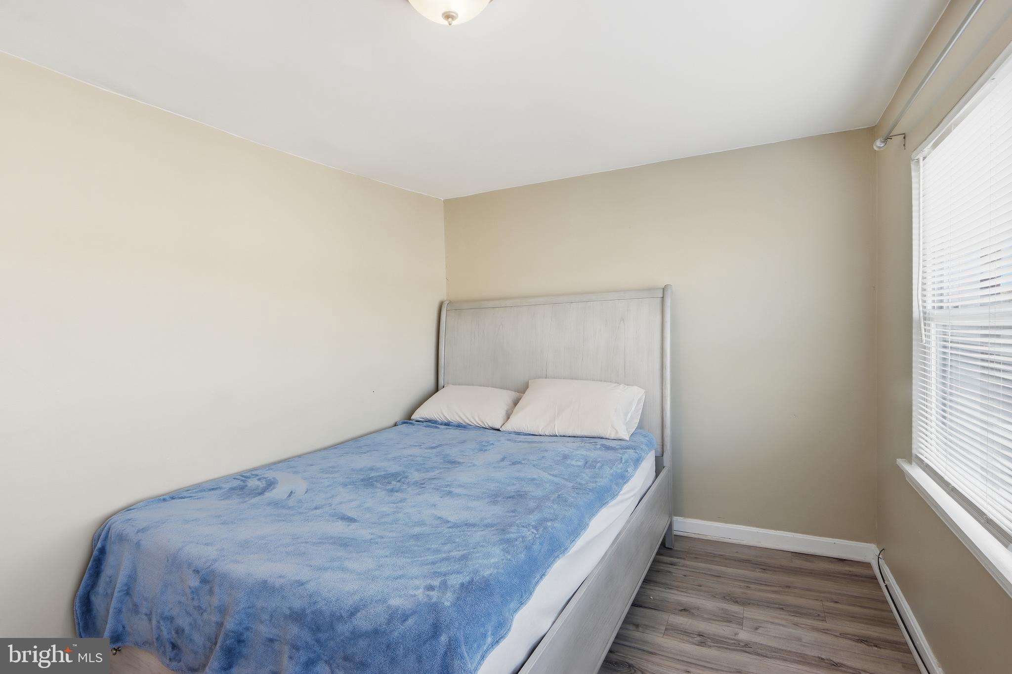 4432 Annapolis Road Baltimore, MD 21227 - Photo 20 of 31 a bedroom with a bed and a window