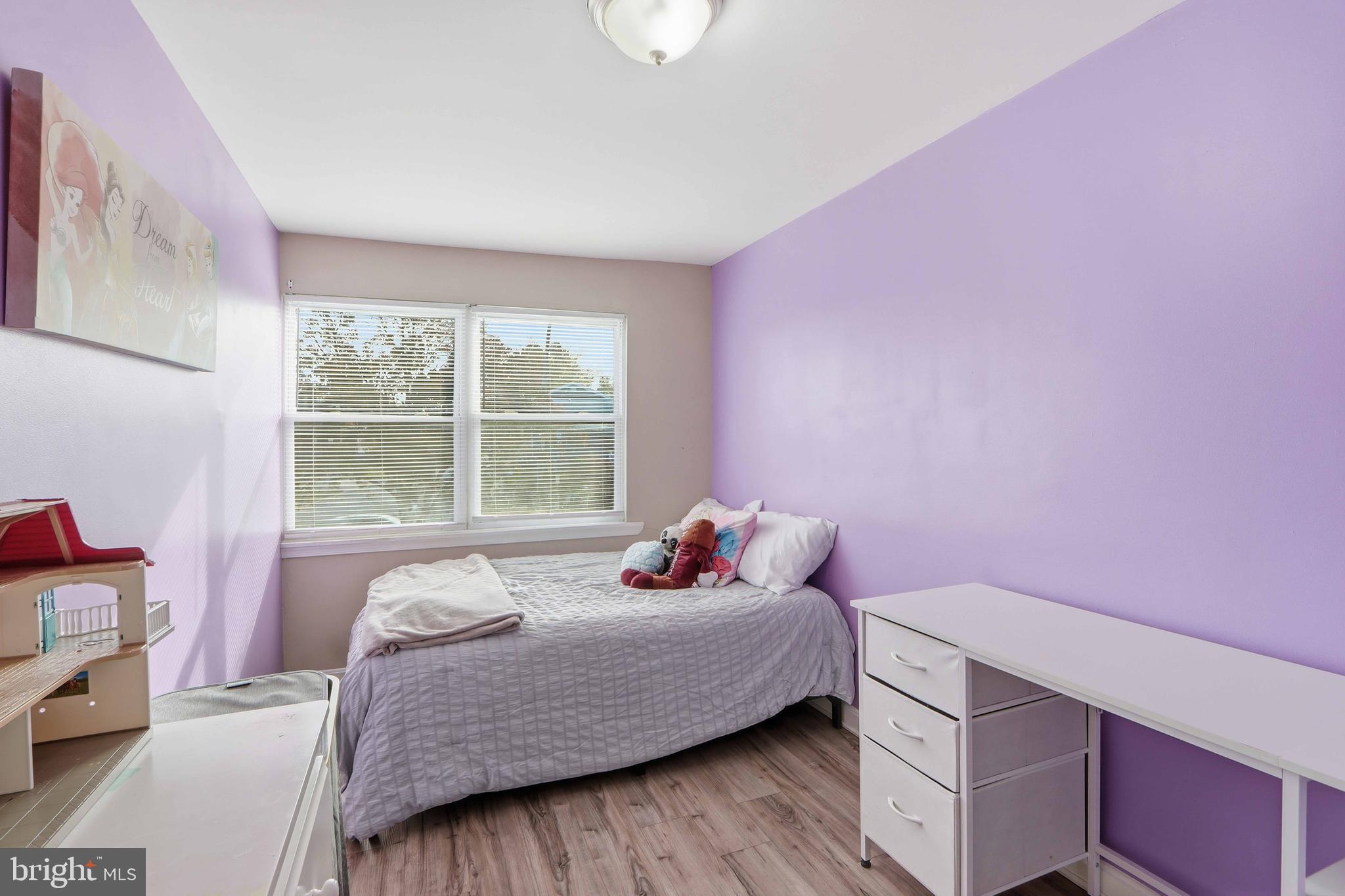 4432 Annapolis Road Baltimore, MD 21227 - Photo 24 of 31 a bedroom with a bed and a window