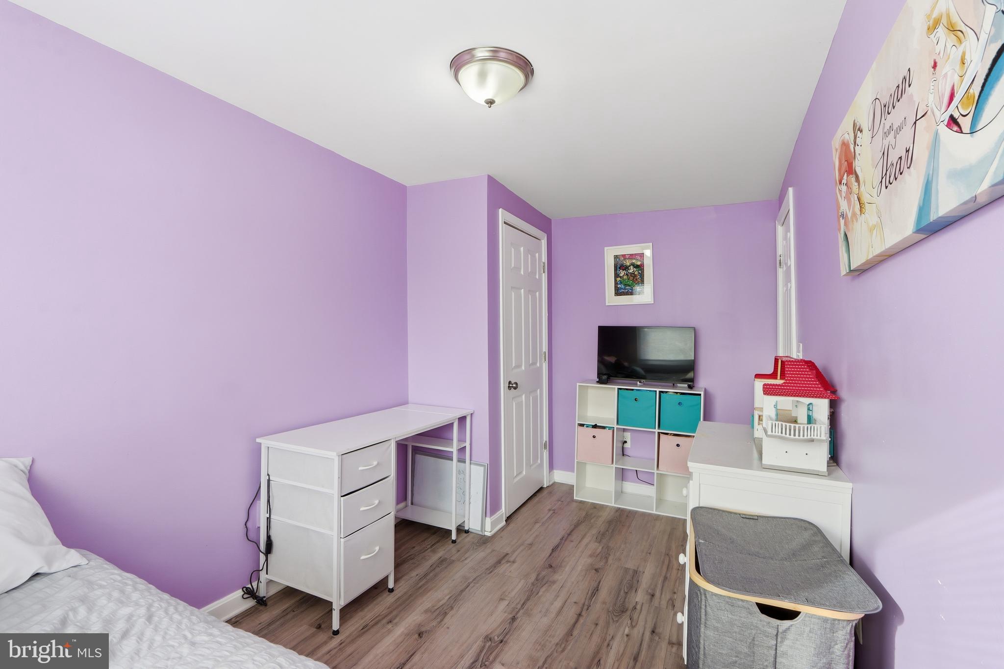 4432 Annapolis Road Baltimore, MD 21227 - Photo 25 of 31 a living room with furniture and a flat screen tv