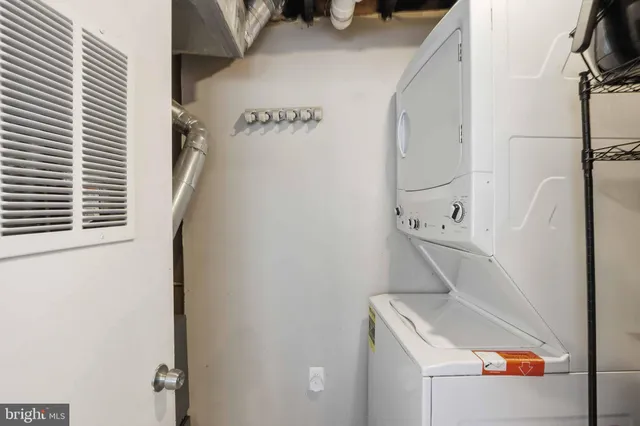 a bathroom with a sink and washing machine