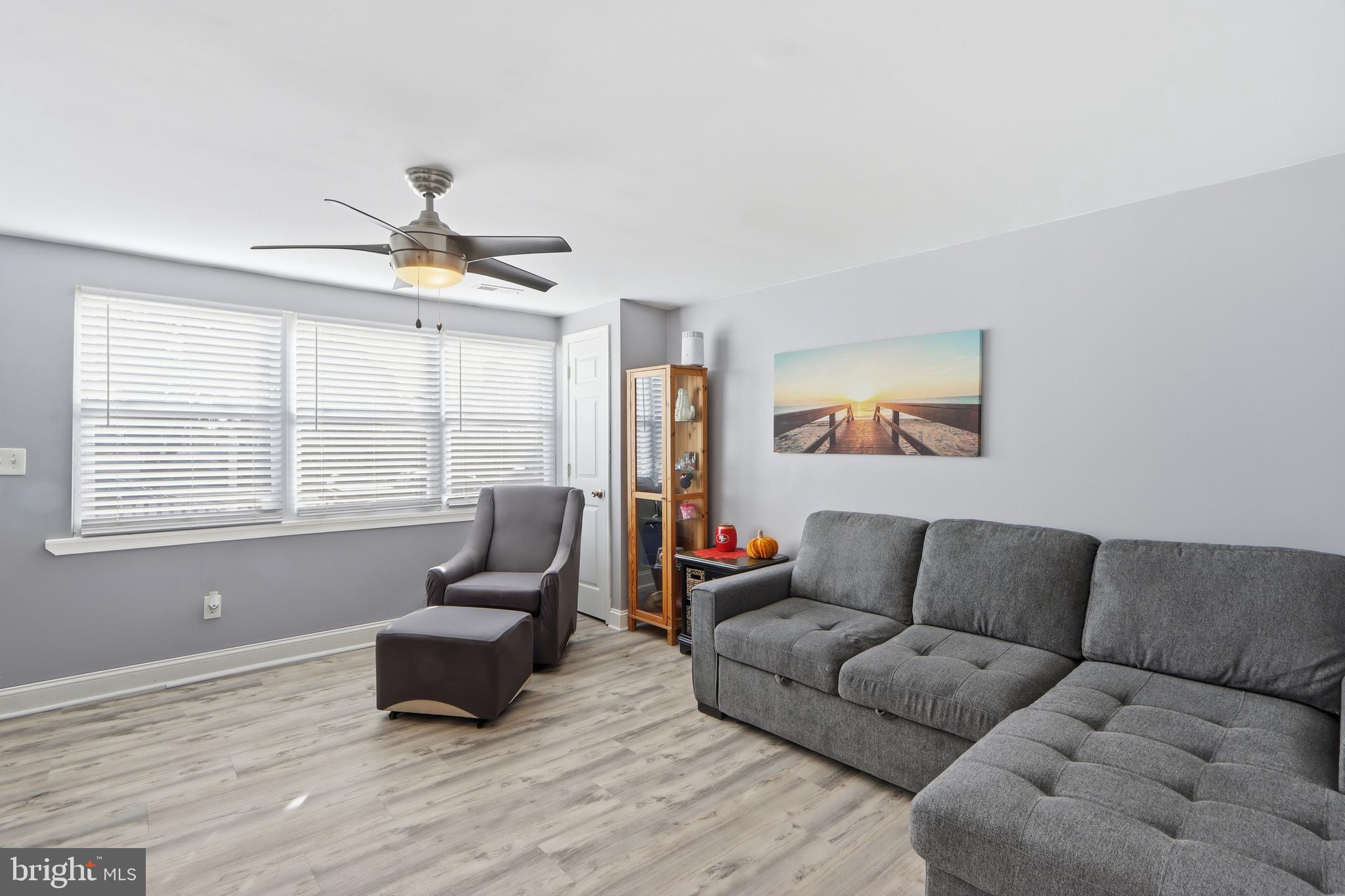 4432 Annapolis Road Baltimore, MD 21227 - Photo 6 of 31 a living room with furniture and a window