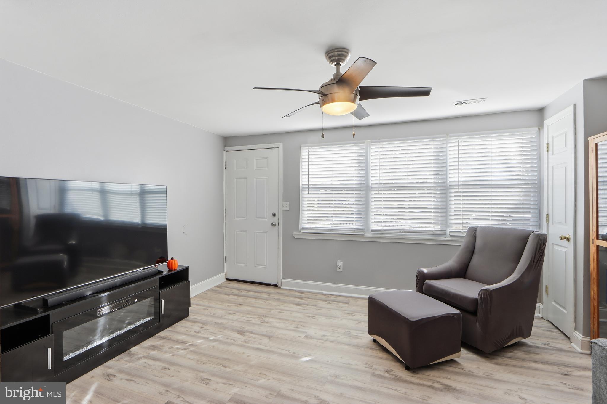 4432 Annapolis Road Baltimore, MD 21227 - Photo 7 of 31 a living room with furniture and a flat screen tv