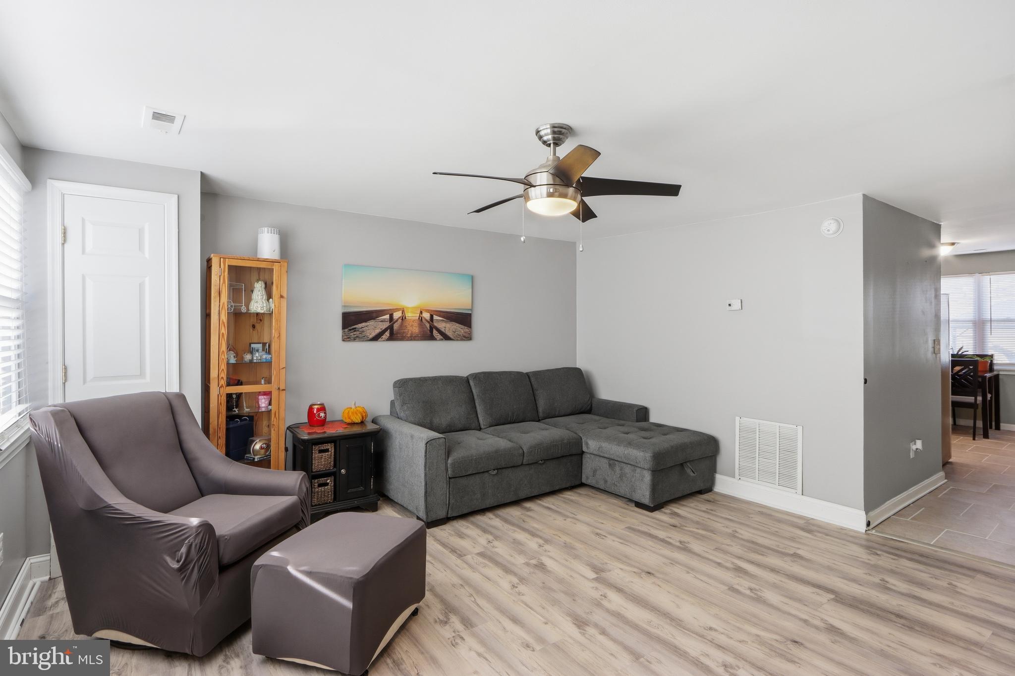 4432 Annapolis Road Baltimore, MD 21227 - Photo 8 of 31 a living room with furniture and a wooden floor