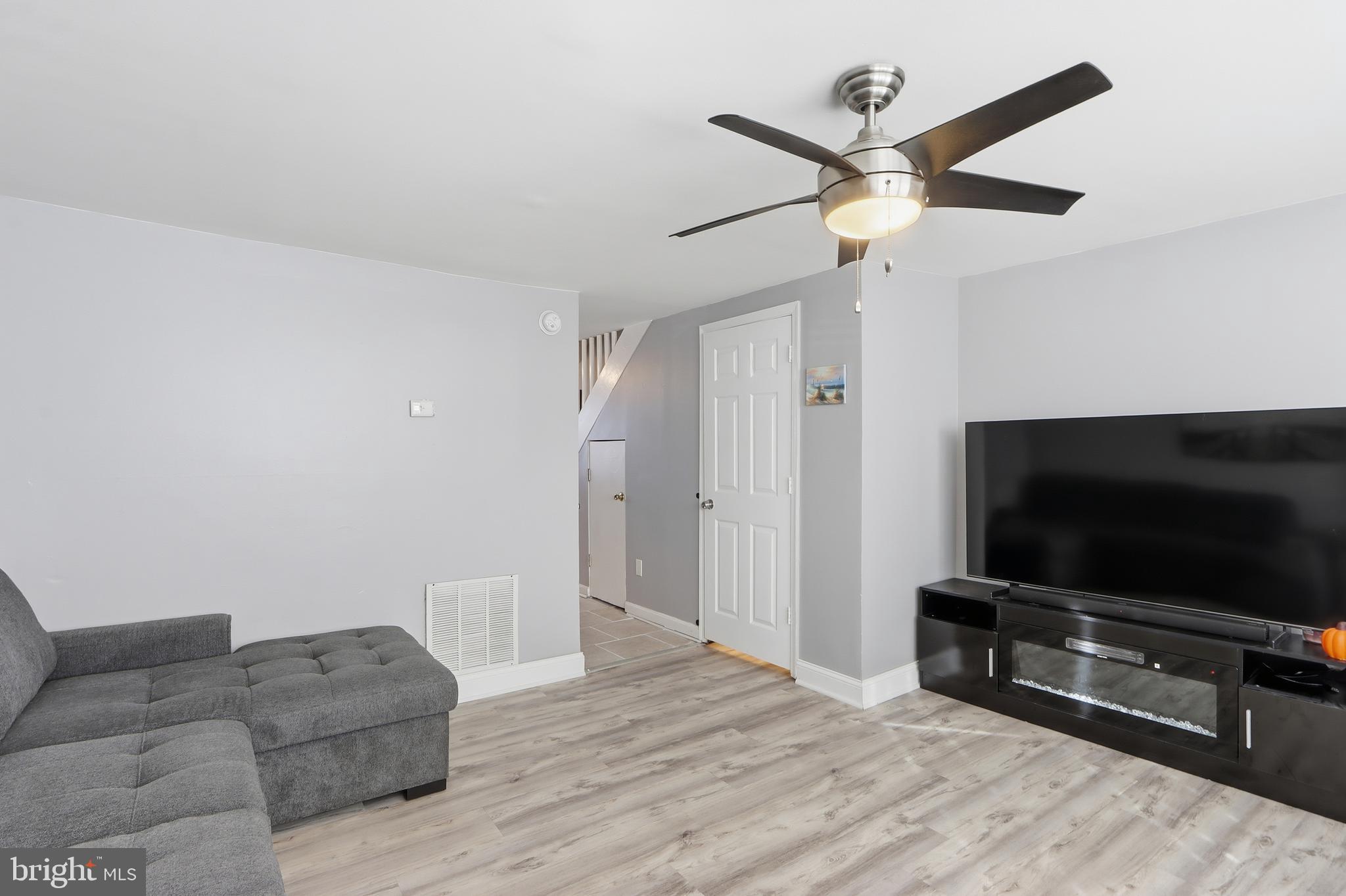 4432 Annapolis Road Baltimore, MD 21227 - Photo 10 of 31 a living room with furniture and a flat screen tv