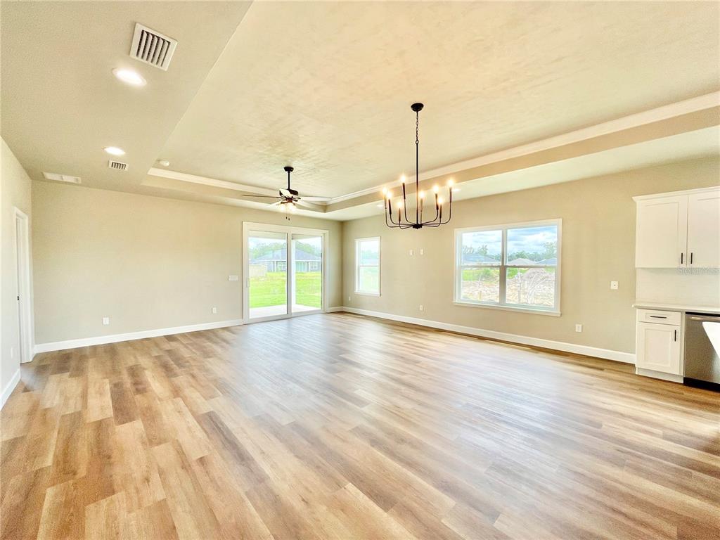 1021 Southwest 67th Street Gainesville, FL 32607 - Photo 6 of 53 a view of empty room with wooden floor and fan