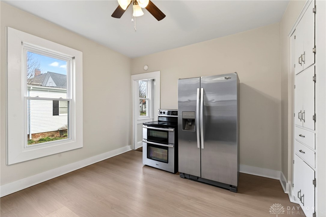 585 North Spring Street Wilmington, OH 45177 - Photo 8 of 21 This spacious kitchen offers ample room for culinary creativity and features sleek appliances.