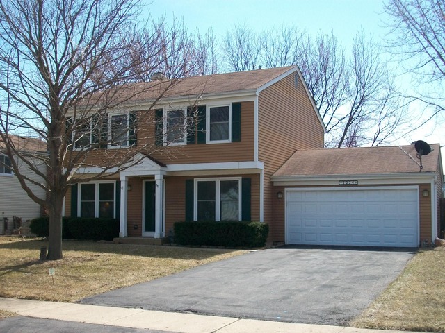 1224 Giese Road Batavia, IL 60510 - Photo 1 of 25 a front view of a house with yard and trees