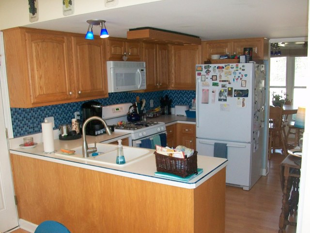 1224 Giese Road Batavia, IL 60510 - Photo 5 of 25 a kitchen with stainless steel appliances granite countertop a sink and a refrigerator