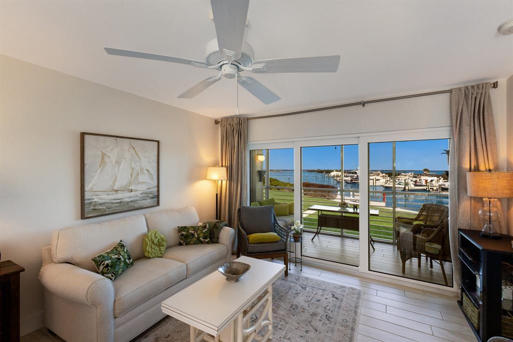 5850 Gasparilla Road, Unit M7 Boca Grande, FL 33921 - Photo 11 of 54 a living room with stainless steel appliances kitchen island granite countertop furniture and a view of kitchen