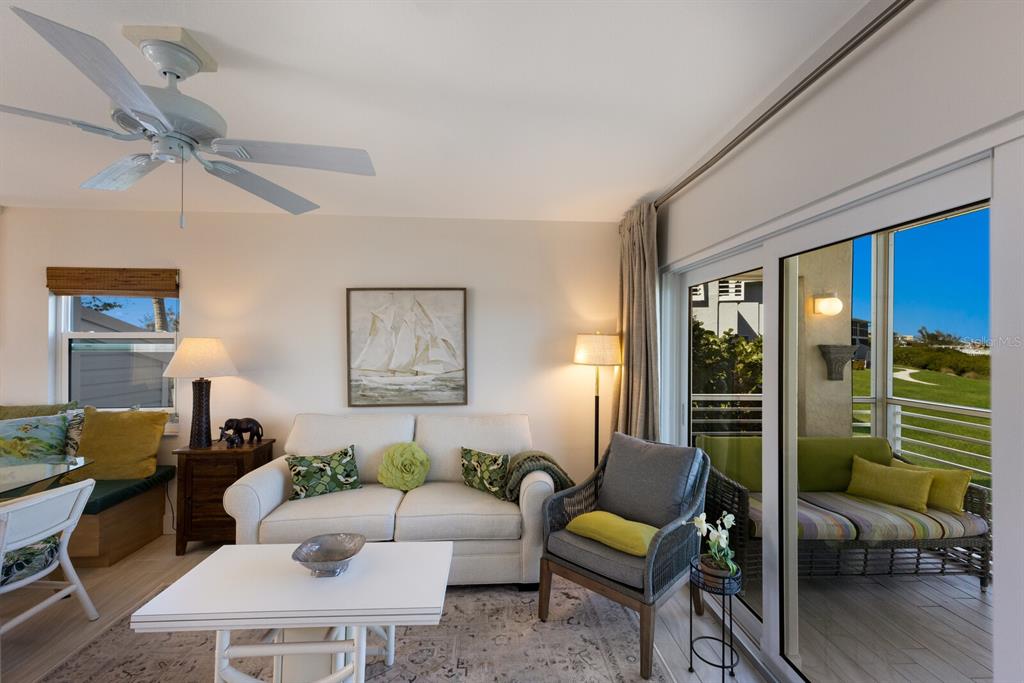 5850 Gasparilla Road, Unit M7 Boca Grande, FL 33921 - Photo 12 of 54 a living room with furniture and a large window