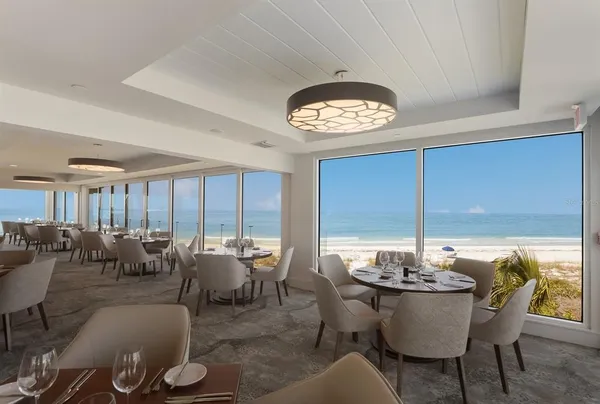 a view of a dining room with furniture window and outside view