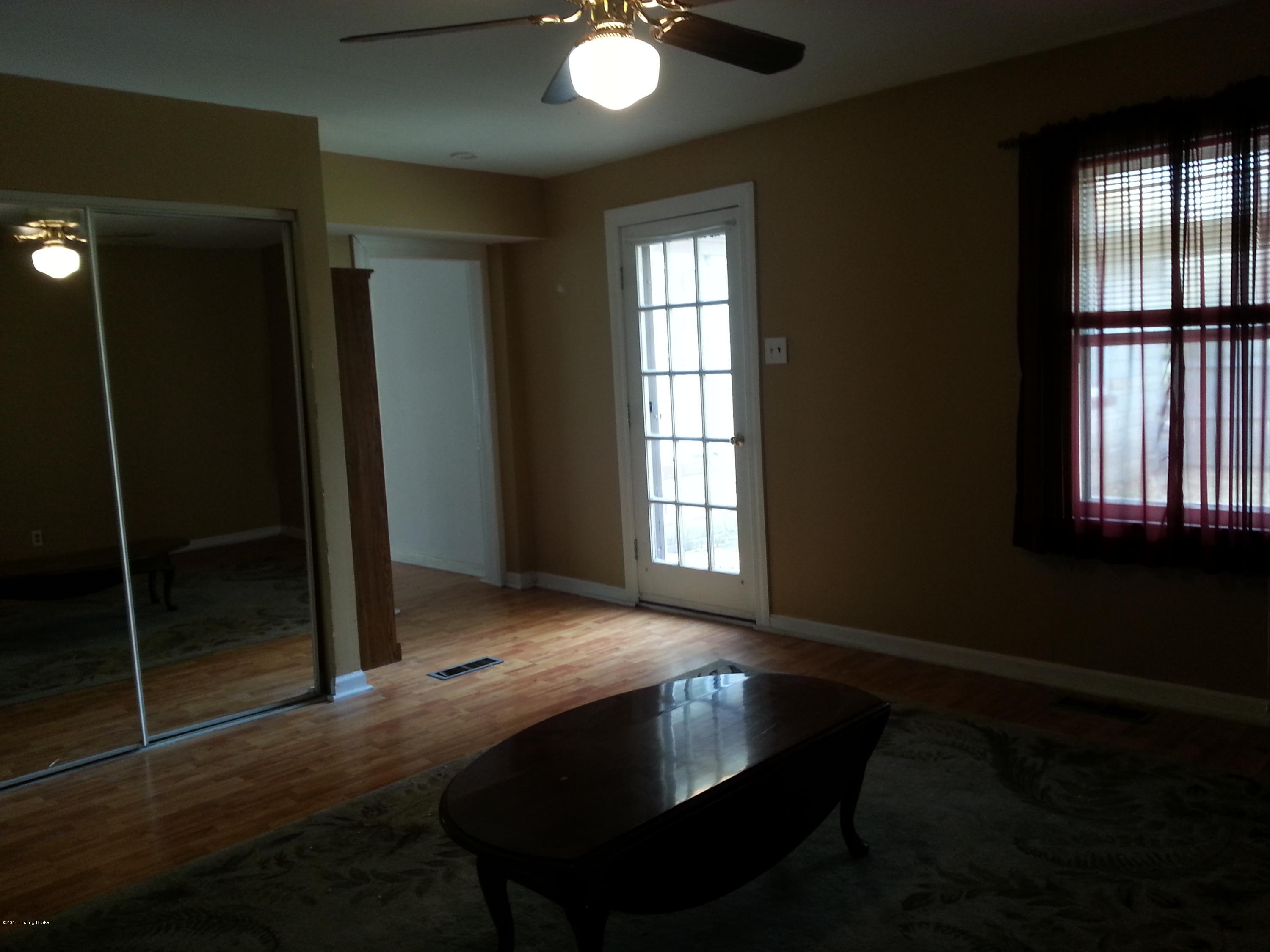 1207 Gallant Fox Run Road Lyndon, KY 40242 - Photo 11 of 22 Nice family room in the back of this home - Laundry closet with sliding doors -and access to the deck.